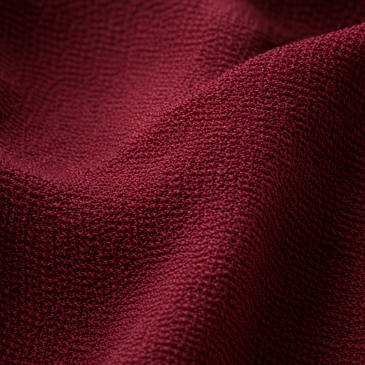 Macro detail of pure silk georgette fabric showing the high-twist crepe weave texture