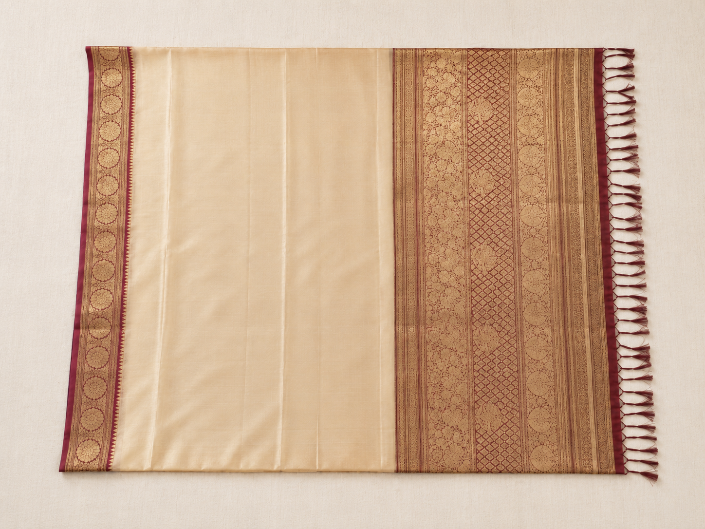 The three parts of a saree — body, pallu, and border — laid flat